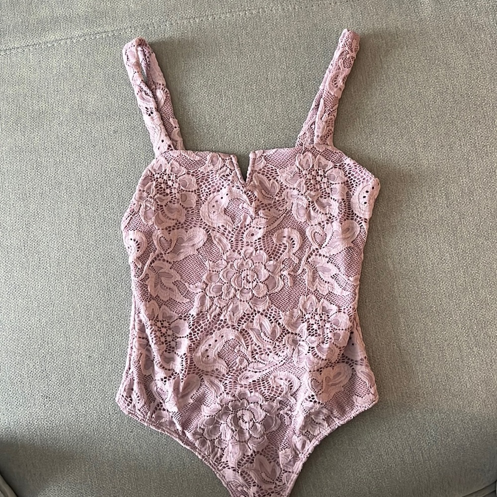 Lace lavender bodysuit. New with tags